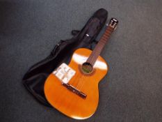 An acoustic guitar with paper label mark