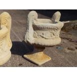 A large twin handled stone urn, Est £25