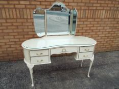 A French style white painted dressing-table,