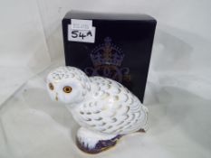 Royal Crown Derby - a Royal Crown Derby paperweight in the form of Snowy Owl with gold stopper,