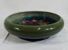 Moorcroft Pottery - Moorcroft Pottery footed bowl decorated with Clematis on a green ground,