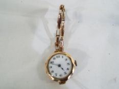 A 9ct rose gold ceramic faced lady's wristwatch Arabic numerals to the dial Est £50 - £60