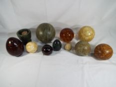 Ten decorative eggs and spheres comprising glass,