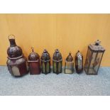 Seven decorative hanging lanterns with glass and pierced decoration