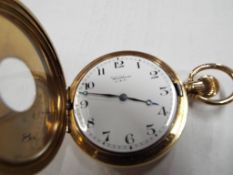 A gentleman's gold plated cased, stem wind half hunter lever pocket watch,