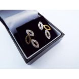 A lady's pair of 9 carat gold 10 point diamond set leaf earrings, approx 2.
