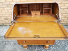 A good quality bureau with carved decoration to the front,