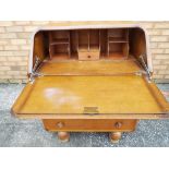 A good quality bureau with carved decoration to the front,