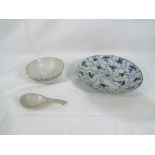 Three pieces of Qing dynasty porcelain comprising a blue and white lotus pattern dish approximately