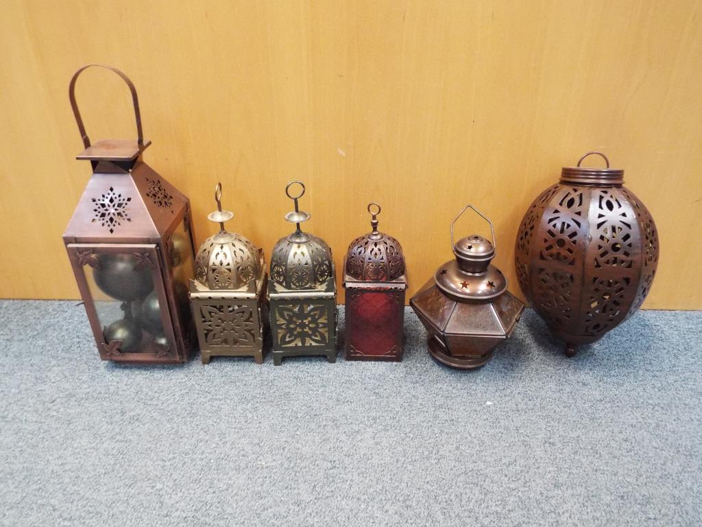 Six decorative hanging lanterns varying sizes with pierced decoration