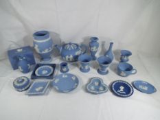 Wedgwood - seventeen pieces of predominantly powder blue Wedgwood Jasper Ware to include tea pot,