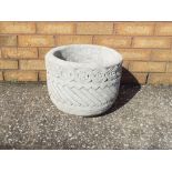 Garden Stoneware - a circular stone planter decorated with Aztec design on a circular base.