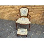 A good quality carved upholstered armchair with matching footstool.