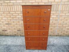 A tallboy with six drawers, approximately 126 cm x 67.