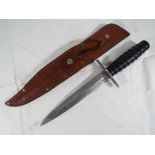 A Rostnever double edged dagger with black Bakelite ribbed handle Est.