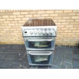 A Cannon electric brushed steel cooker approximate height 91 cm x 50 cm x 60 cm, unused.
