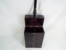 A decorative two bottle wine carrier,