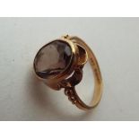 A lady's hallmarked 9 carat yellow gold ring set with smoky quartz, size L:, approx weight 2.