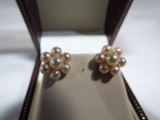 A pair of 9ct and pearl cluster earrings,