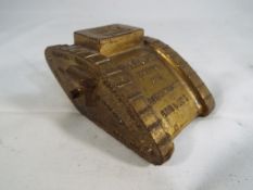 A World War One (WW1) period bronze novelty advertising paperweight in the style of a military tank