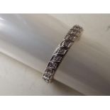 A lady's 9 carat gold 15 point diamond set full eternity ring, approx 2.