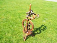 A wooden spinning wheel,