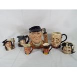 Seven character jugs to include Royal Doulton D6623 Golfer approx 19cms (h),