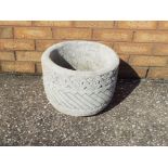 Garden Stoneware - a circular stone planter decorated with Aztec design on a circular base.