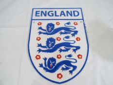 A cast iron England Football wall plaque, 31 cm x 22.5 cm .