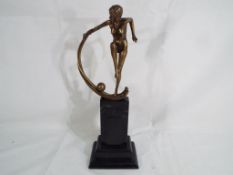 An Art Deco style figurine depicting a female nude approx 34cm (h)