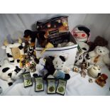 A mixed lot of predominantly soft toys and a novelty photo frame in the form of a cow also included