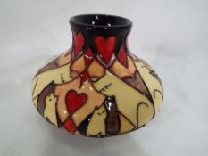 Moorcroft Pottery - a Moorcroft Pottery Purring Cat's vase approx 8cm (h) Est £100 - £150