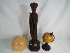 A large Chinese figurine depicting a courtier approx 55cm (h) and two terrestrial globes (3)