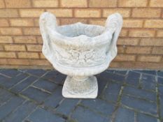 Garden Stoneware - a large decorative stone two-handled urn.