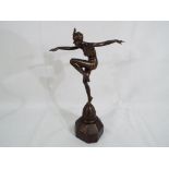 An Art Deco style figurine depicting a lady in a bathing costume approx 24.