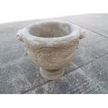 A twin handled urn