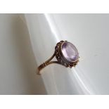 A lady's hallmarked 9 carat yellow gold ring set with amethyst, size O+1/2, approx 2.