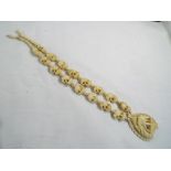 A carved bone necklace and pendent with screw clasp