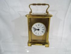 A contemporary French eight day carriage clock with mechanical movement,