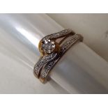 A lady's 9 carat gold diamond set two-piece twin set ring, approx 2.