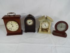 Three clocks and a barometer