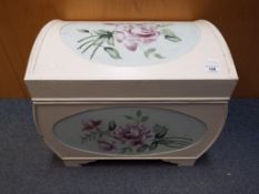 A good quality wooden storage chest with hand-painted floral decoration,