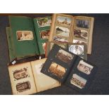 Six vintage albums containing a quantity of UK and foreign topographical and subject postcards,