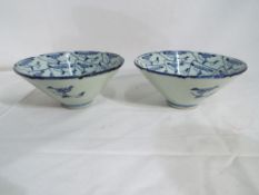 A pair of Chinese ceramic deep form bowls, blue and white decoration approx 6.5cm (h) 14.