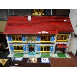 Dolls House - a two storey dolls house of wooden construction with furniture 44cm x 33cm x 73cm -