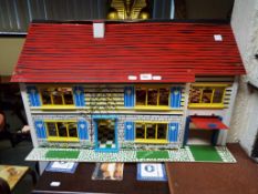 Dolls House - a two storey dolls house of wooden construction with furniture 44cm x 33cm x 73cm -
