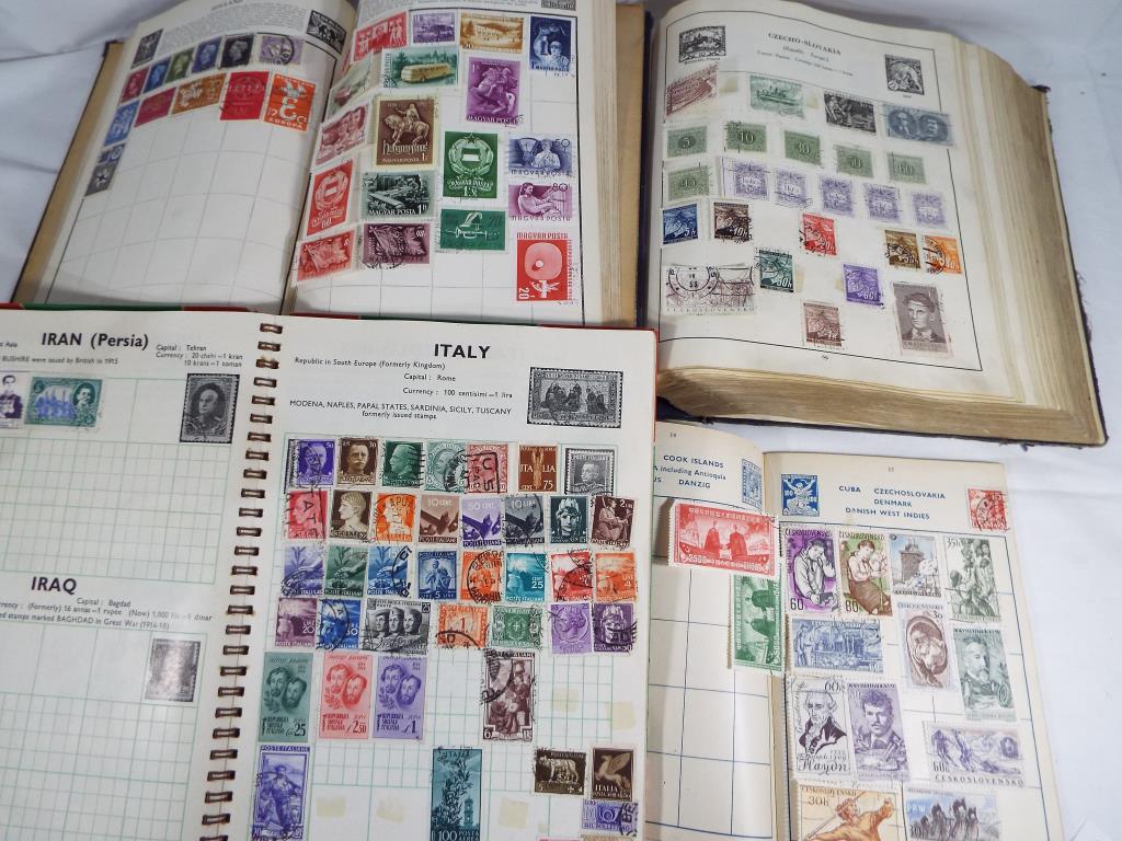 Philately - four albums of UK and world postage stamps,