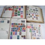 Philately - four albums of UK and world postage stamps,