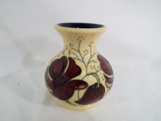 Moorcroft Pottery - a Moorcroft Pottery vase decorated in the Cosmos pattern,
