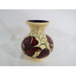 Moorcroft Pottery - a Moorcroft Pottery vase decorated in the Cosmos pattern,